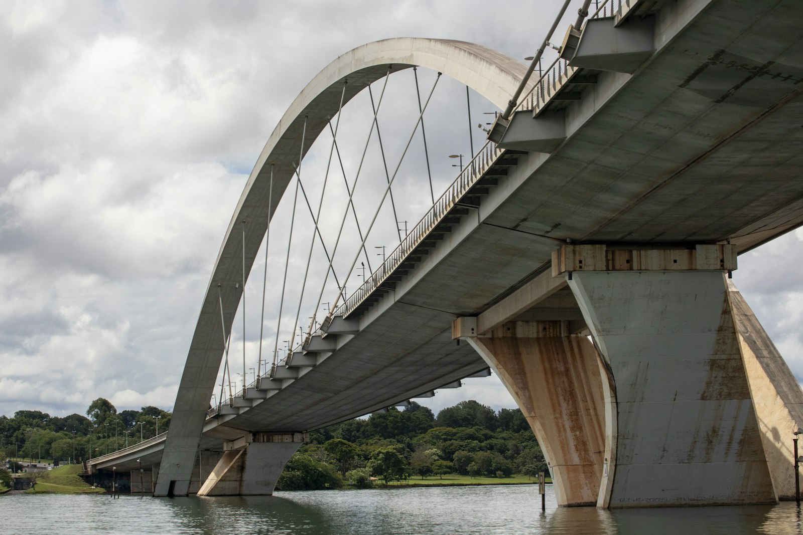 A concrete arch bridge structure spanning a river.