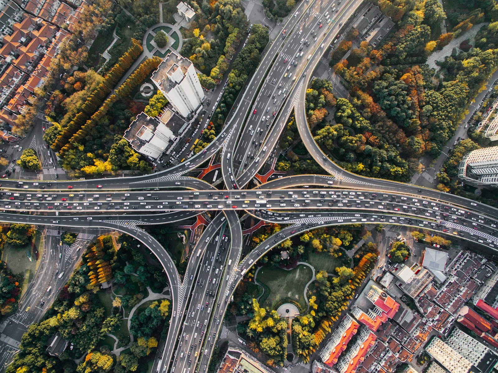 A large highway interchange seen from above, showing curved concrete carriageways.